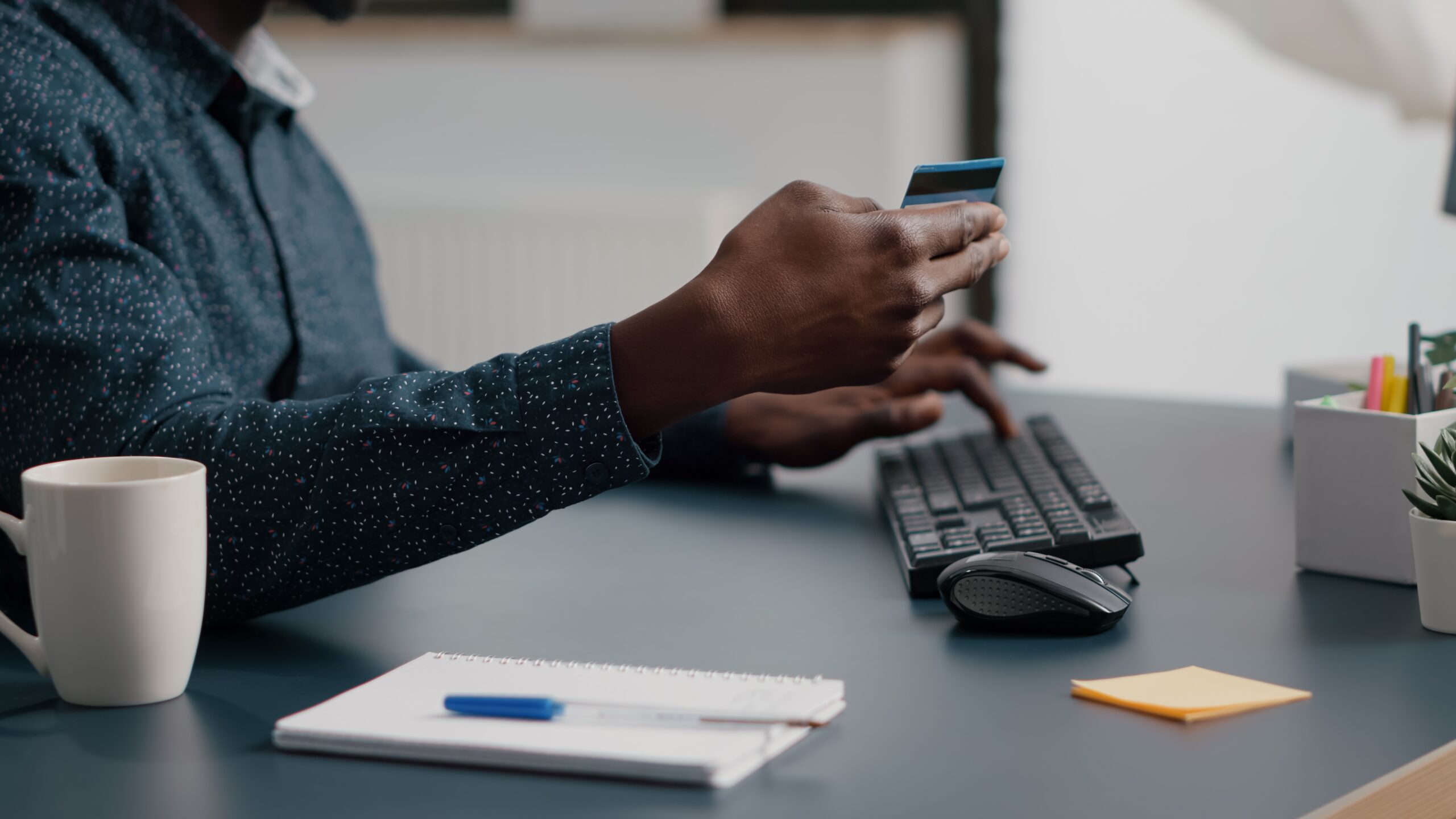 Close,Up,Of,African,American,Man,Hands,Typing,Credit,Card