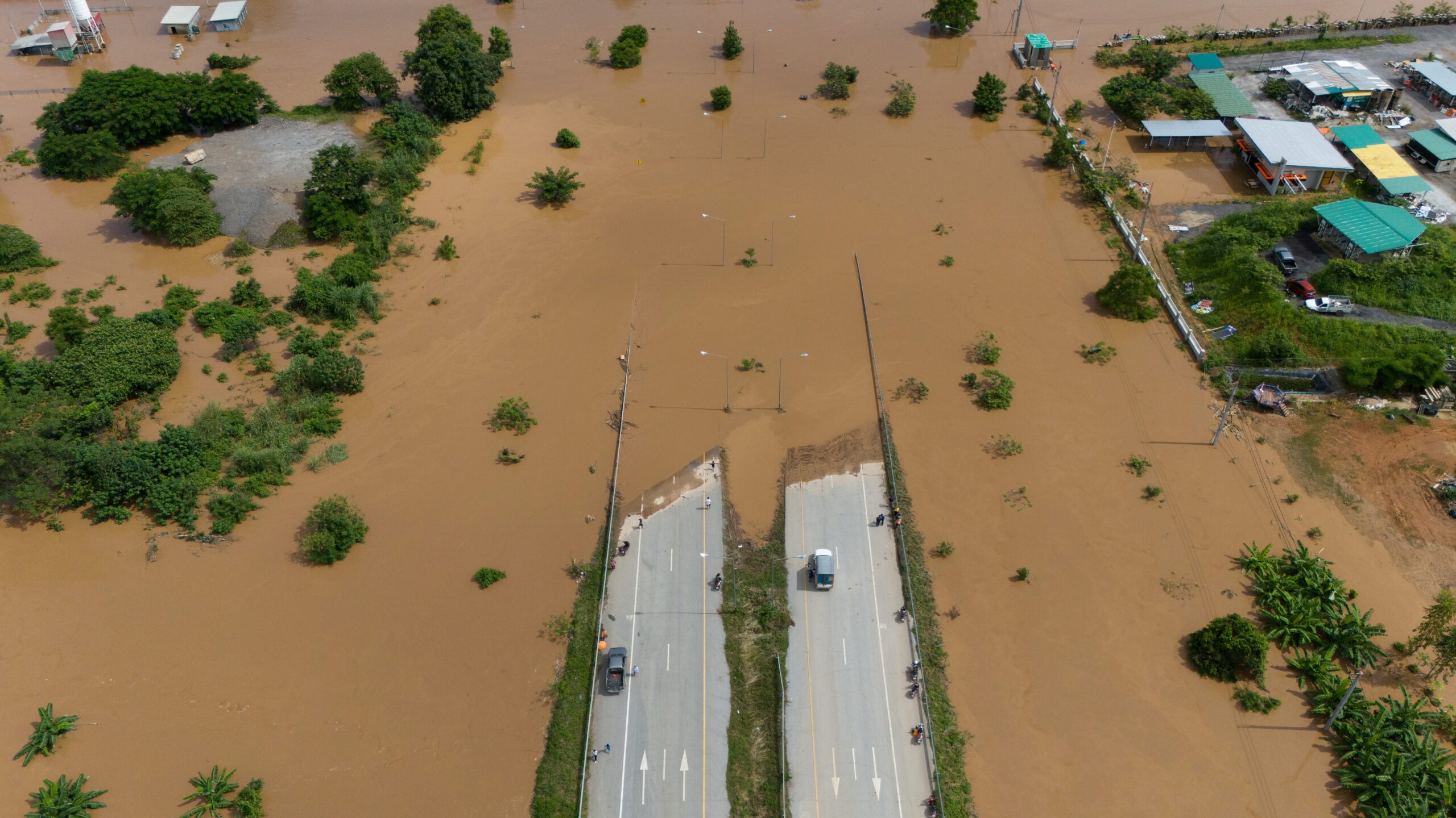 Aerial,View,Of,Car,Stuck,On,The,Bridge,After,Road