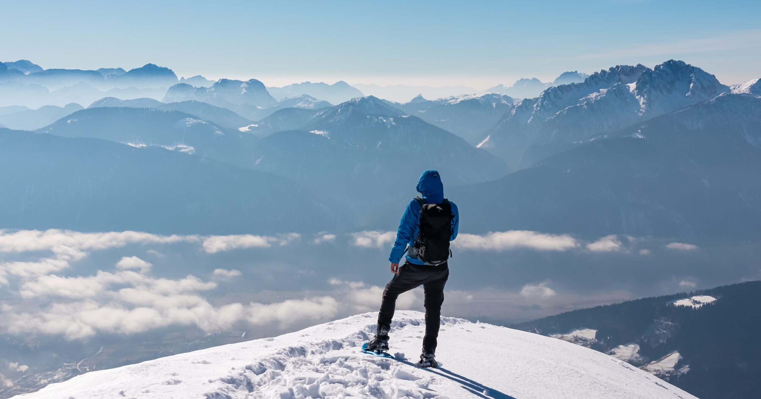 Hiker,Man,Stands,Atop,Snowy,Golz,Summit,In,Gailtal,Alps,