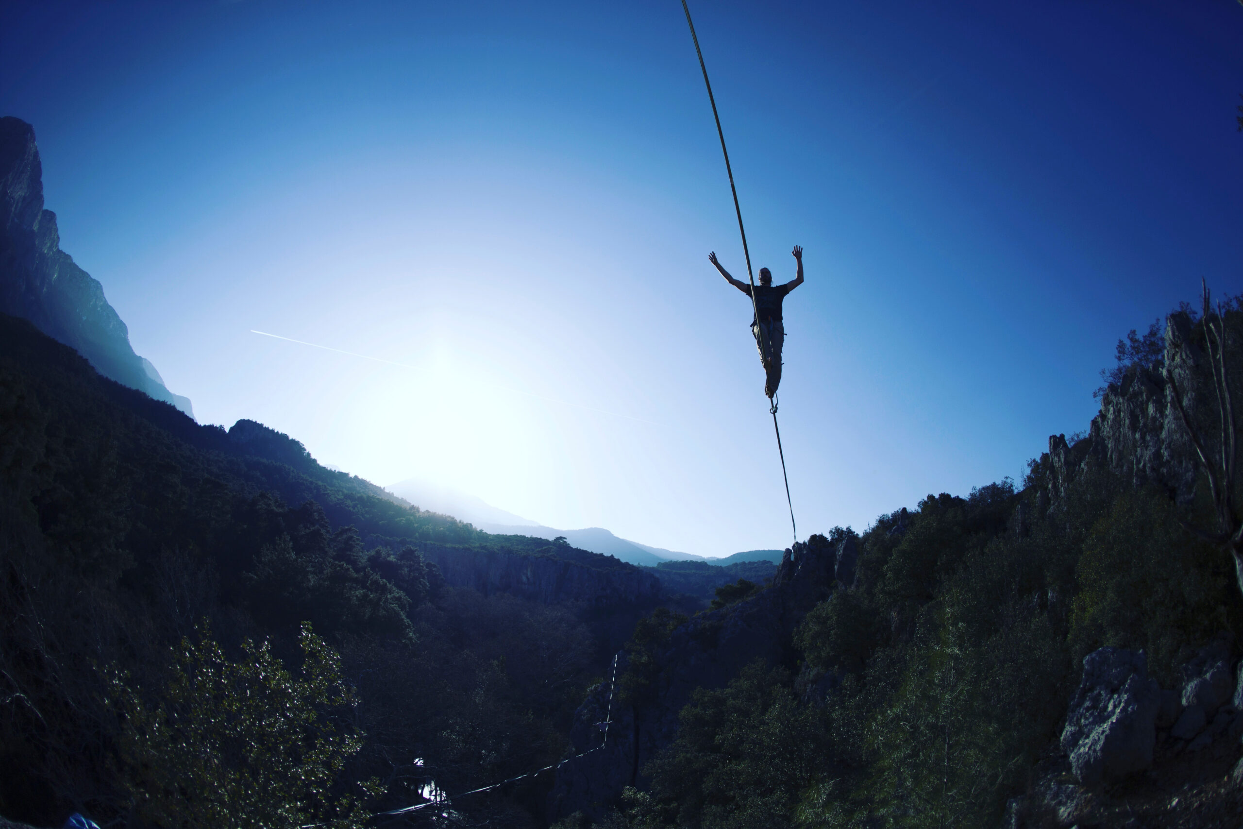 A,Man,Is,Walking,Along,A,Stretched,Sling.,Highline,In