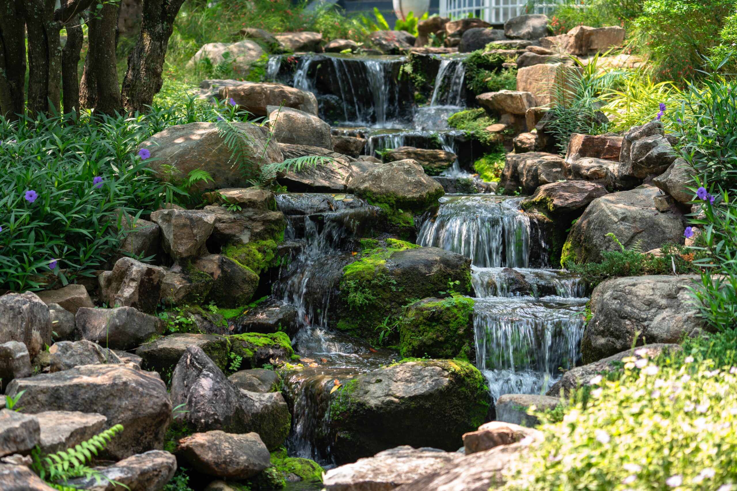 A,Wide,Shot,Of,A,Beautiful,Artificial,Waterfall,In,A